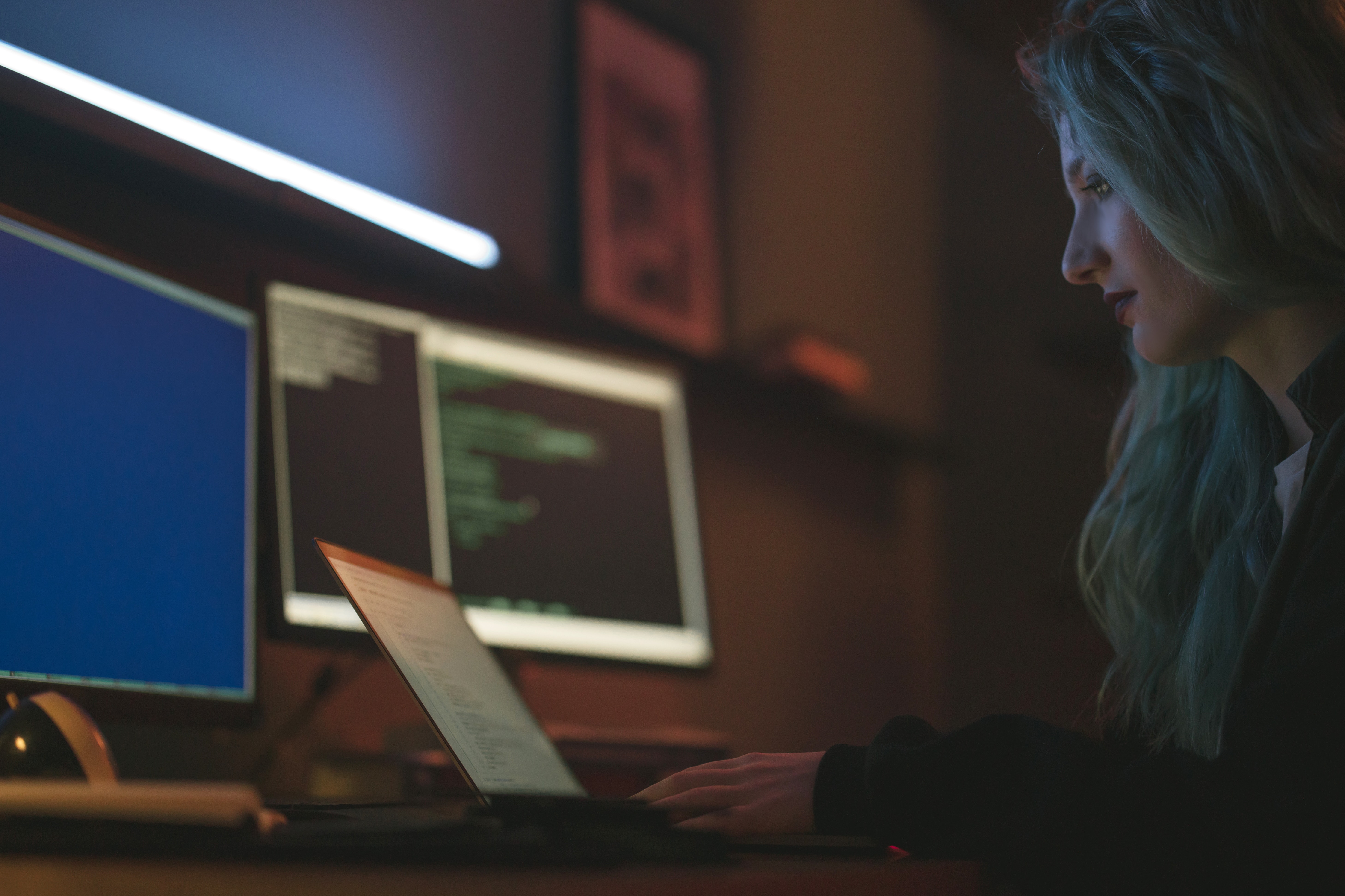 woman sat working at laptop